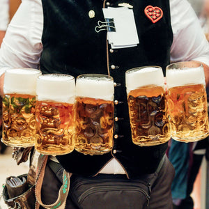 Beers at Oktoberfest are traditionally served in large stein mugs